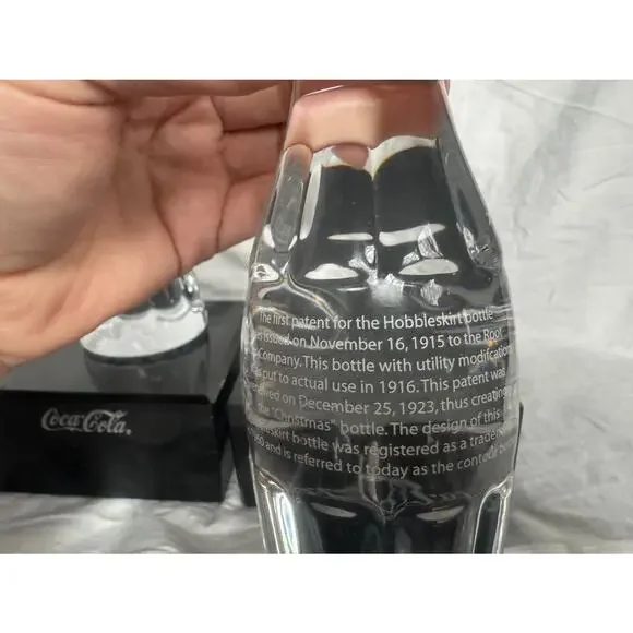 Set of 2 Coca-Cola Collectors Christmas‎ Bottles Hobbleskirt solid & stands 6 oz